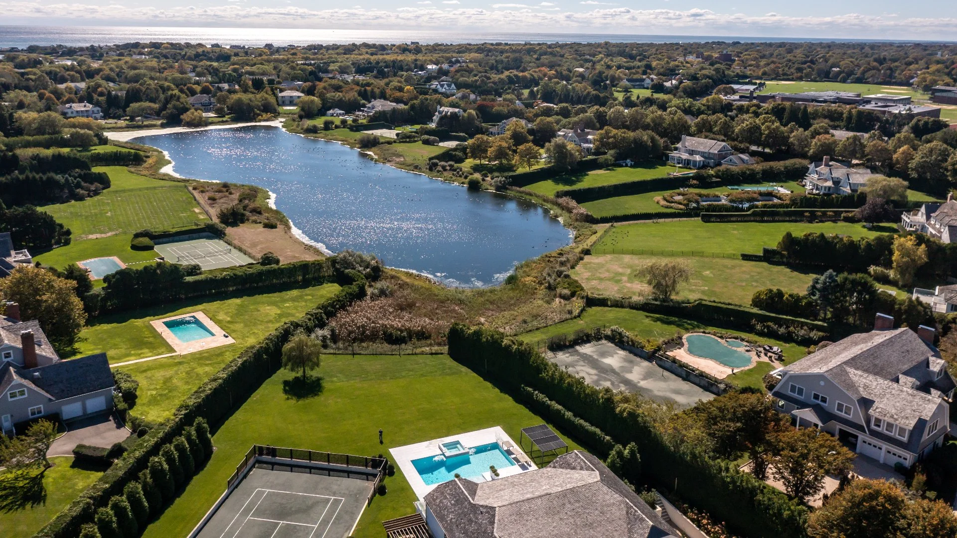 Aerial photo of pool homes in Hamptons, NY.