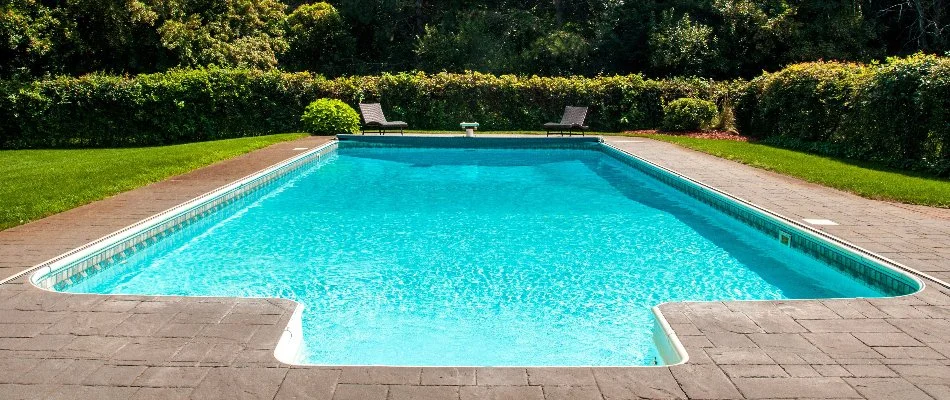 Hedge shrubs around a pool in Bridgehampton, NY.