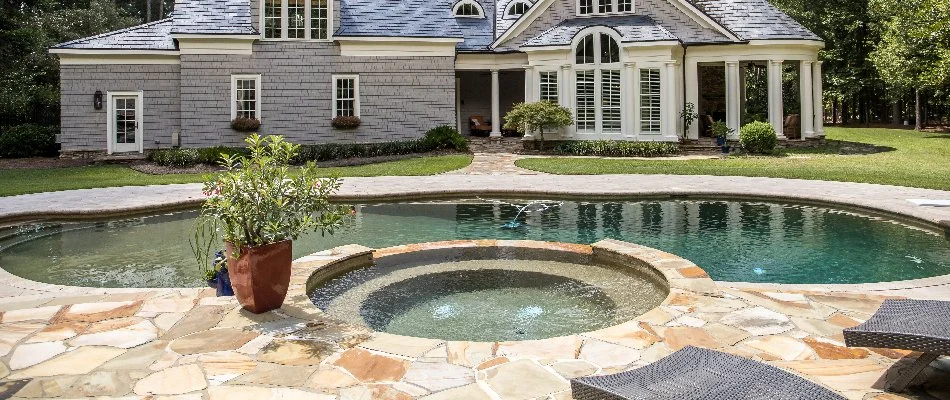 House in Bridgehampton, NY, with a large pool and spa.
