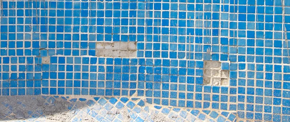 Pool surface in Bridgehampton, NY, with damaged tile.