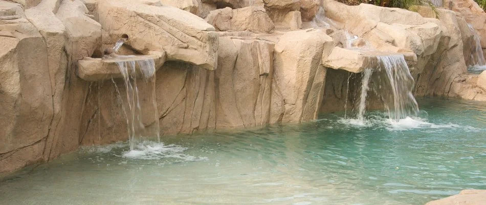 Pool in Bridgehampton, NY, with a waterfall.