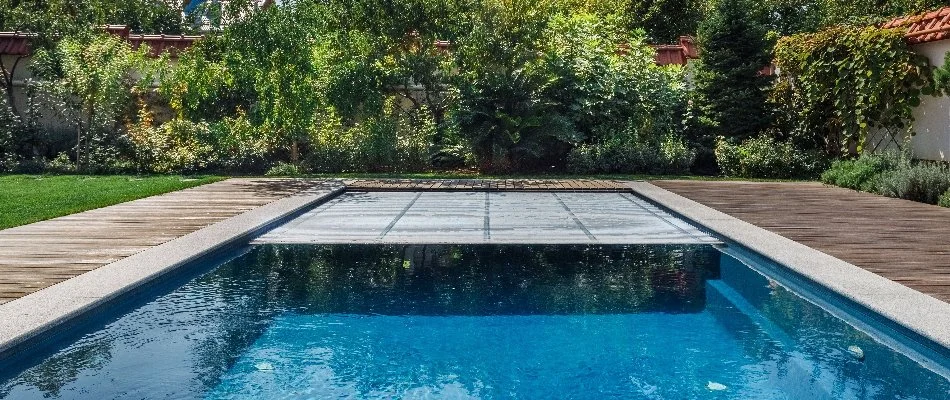 Pool with automatic cover in Bridgehampton, NY.