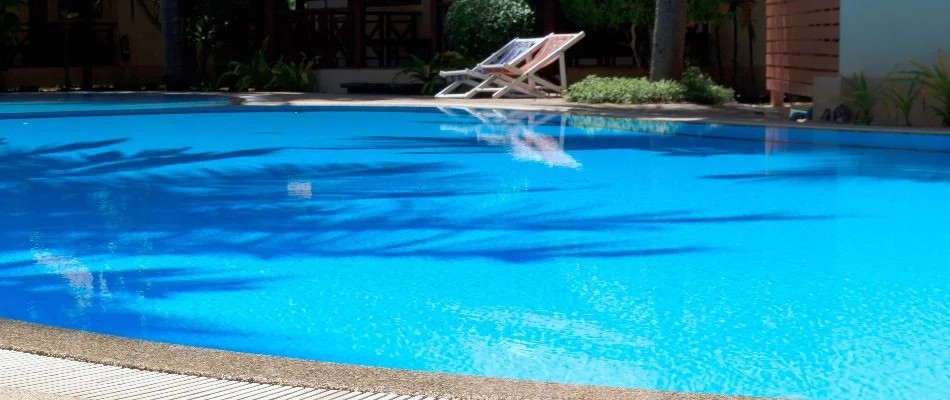 Pool with chairs in Bridgehampton, NY.