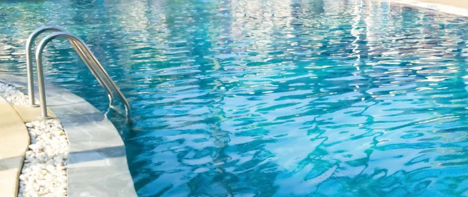 Pool in Bridgehampton, NY, with guard rail.