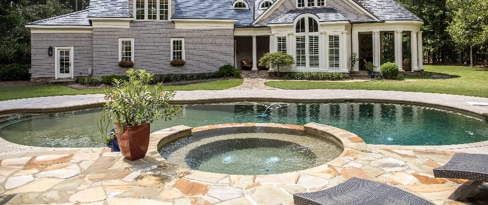Pool in Bridgehampton, NY, with round spa.