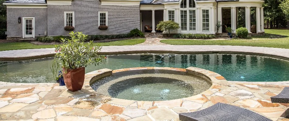Pool with built-in spa in Bridgehampton, NY.