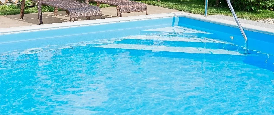 Pool with steps in Bridgehampton, NY.