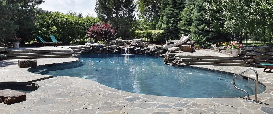 Pool in Bridgehampton, NY, with a waterfall.