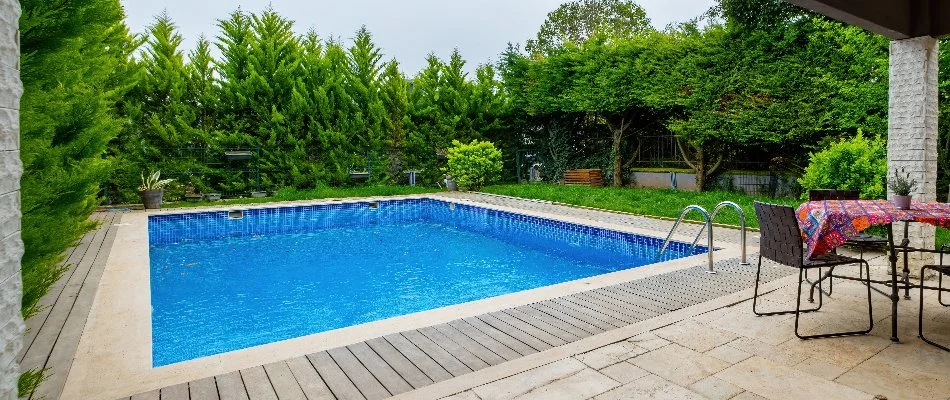 Trees around a pool in Bridgehampton, NY.
