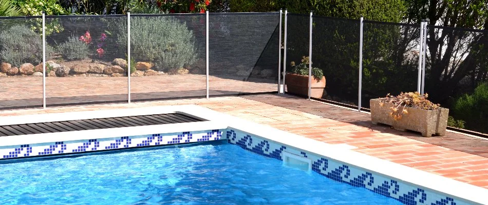 Baby fence around a pool in Bridgehampton, NY.