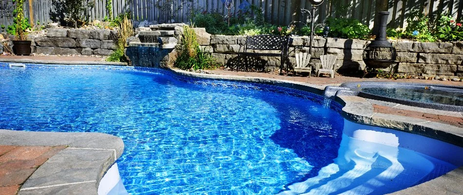 Landscaping beside a pool in Quogue, NY.