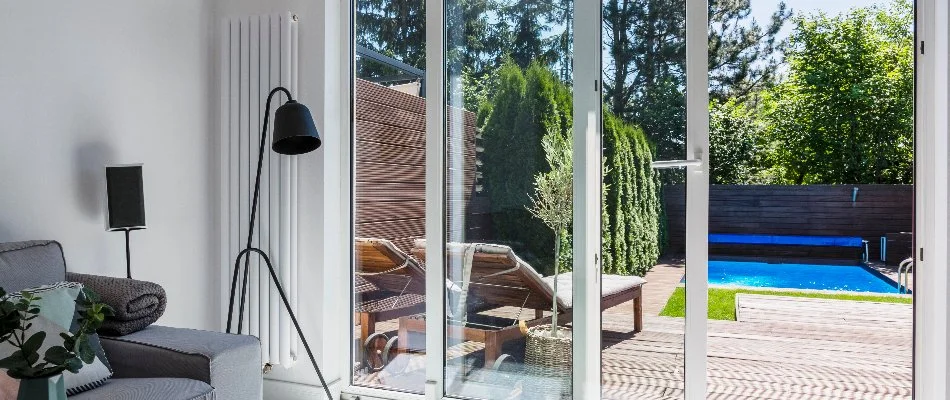 Open door leading to a pool in Bridgehampton, NY.