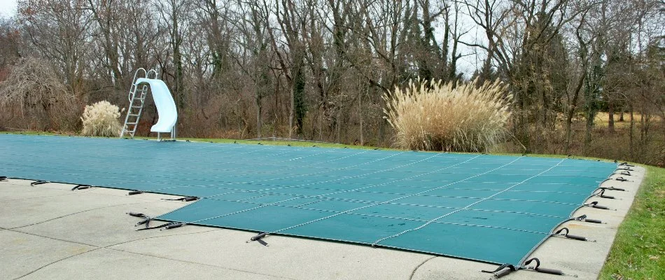 Covered pool in Bridgehampton, NY, with slide.