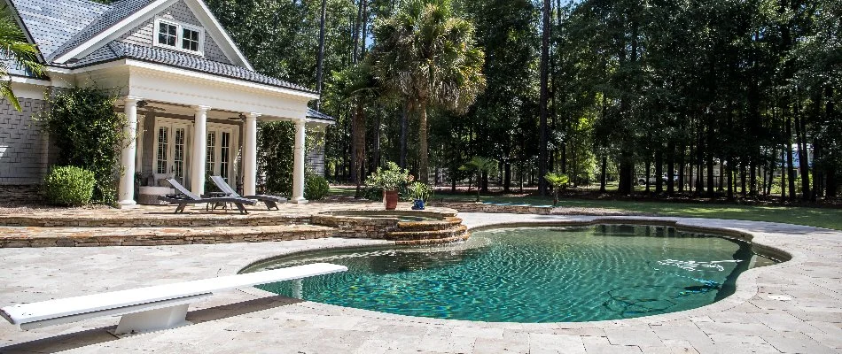 Pool with a diving board in Suffolk County, NY.