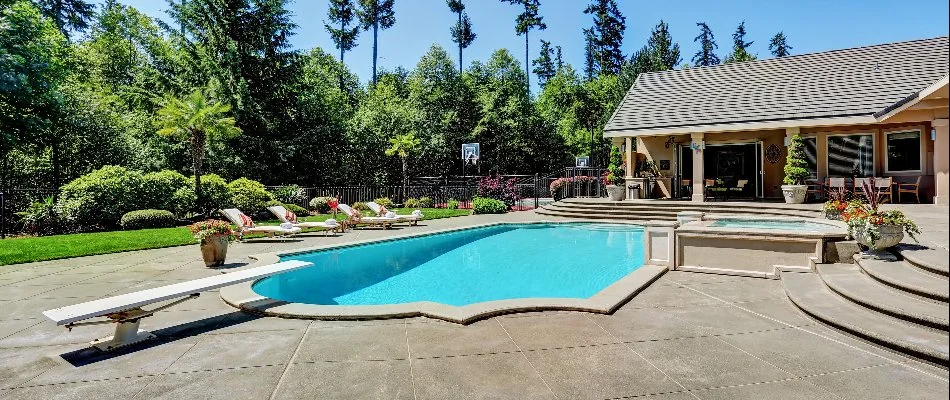 Pool with a diving board in Water Mill, NY.