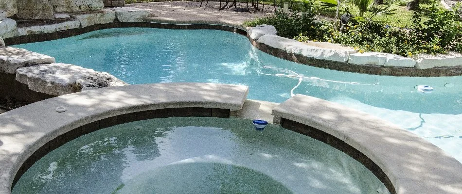 Pool with spa in Shinnecock Hills, NY.